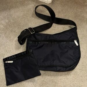 Black Lesport sac adjustable bag with matching pouch. Like new!